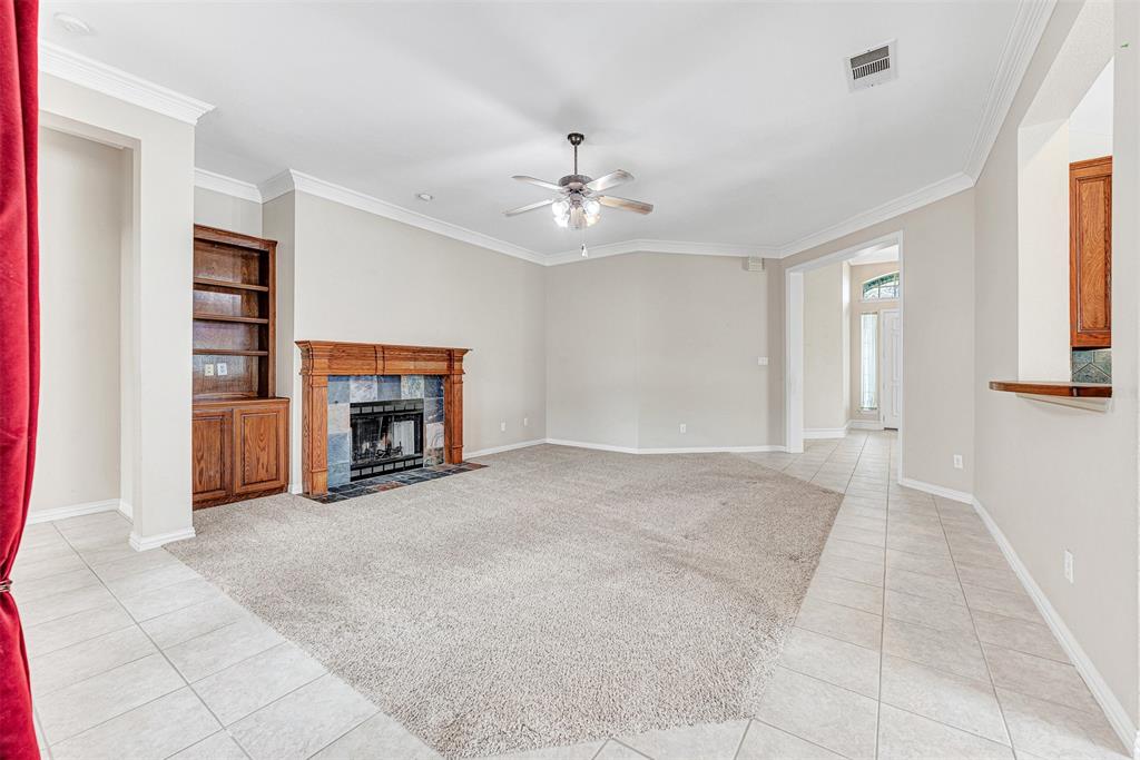 3500 Neiman Road Plano, TX 75025 - Photo 10 of 29 a view of an empty room with window and fireplace