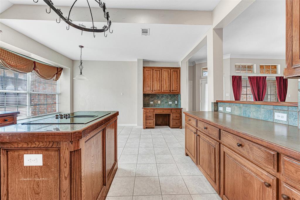 3500 Neiman Road Plano, TX 75025 - Photo 14 of 29 a kitchen with stainless steel appliances granite countertop a sink and cabinets