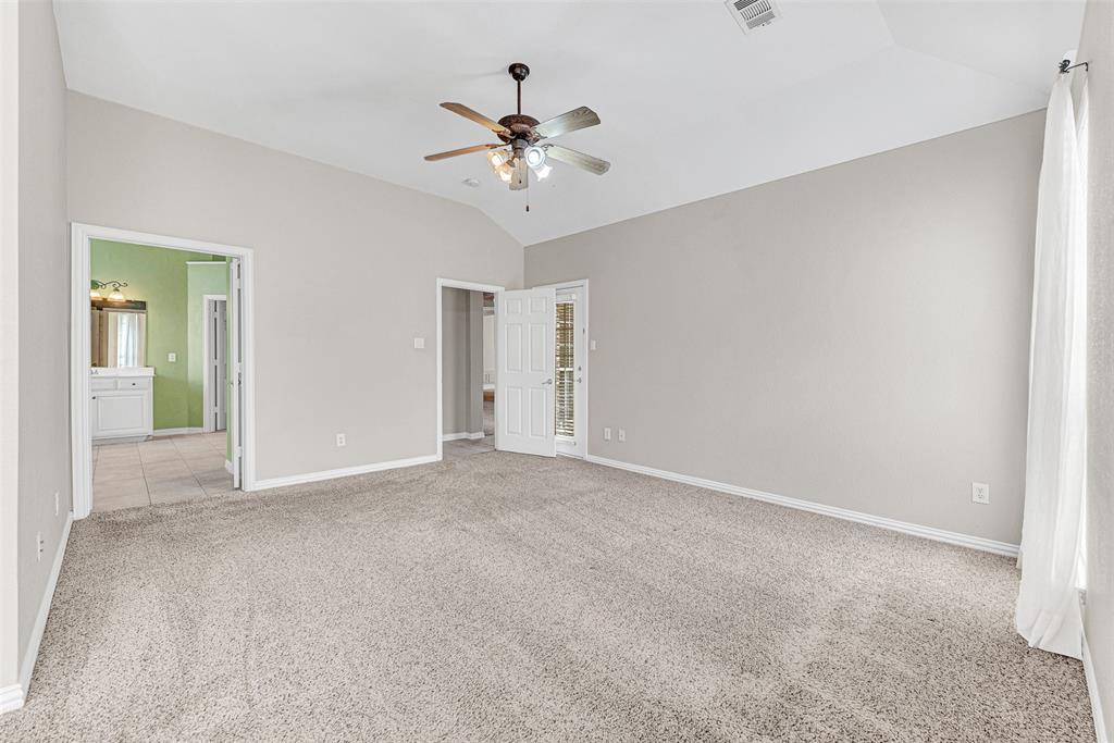 3500 Neiman Road Plano, TX 75025 - Photo 17 of 29 a view of an empty room with a chandelier fan