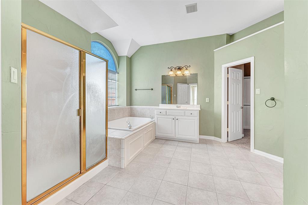 3500 Neiman Road Plano, TX 75025 - Photo 18 of 29 a large bathroom with a tub shower and sink