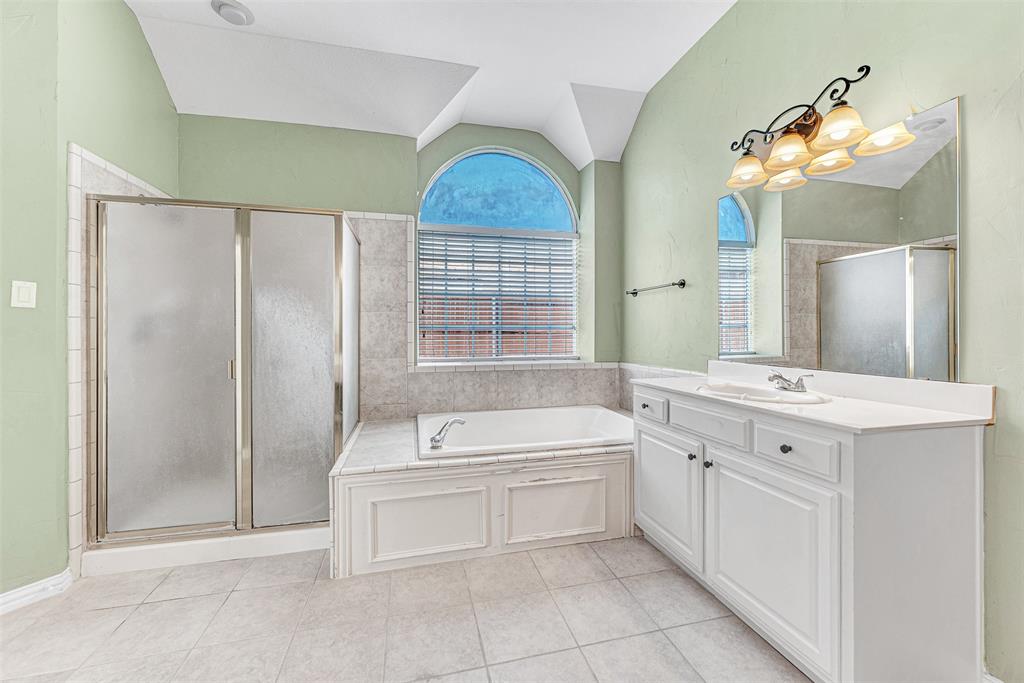3500 Neiman Road Plano, TX 75025 - Photo 19 of 29 a spacious bathroom with a double vanity sink mirror and bathtub