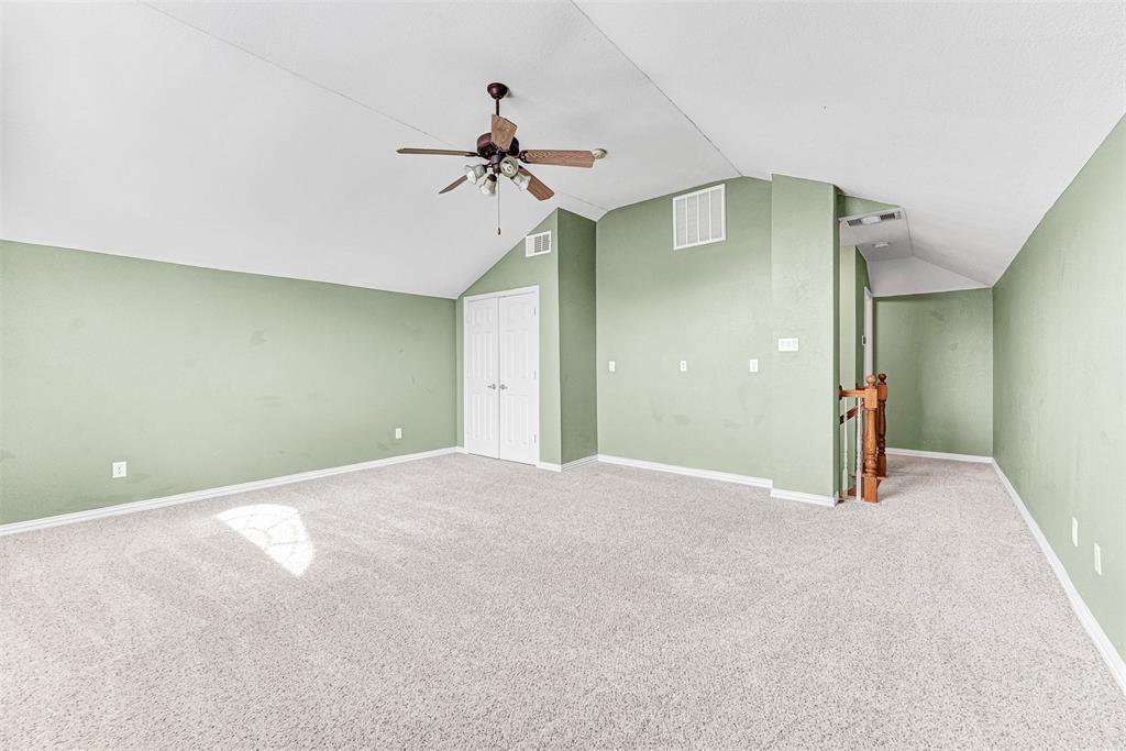 3500 Neiman Road Plano, TX 75025 - Photo 22 of 29 a view of a big room with closet and chandelier fan