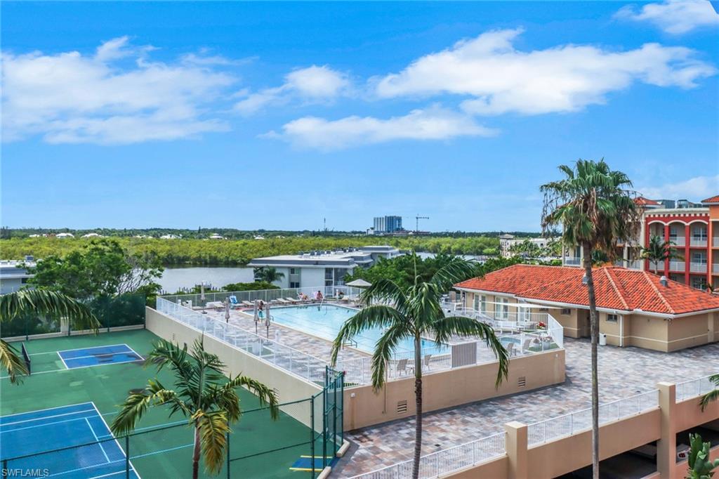 401 Bayfront Place, Unit 3508 Naples, FL 34102 - Photo 24 of 36 Community pool featuring view of wooded area