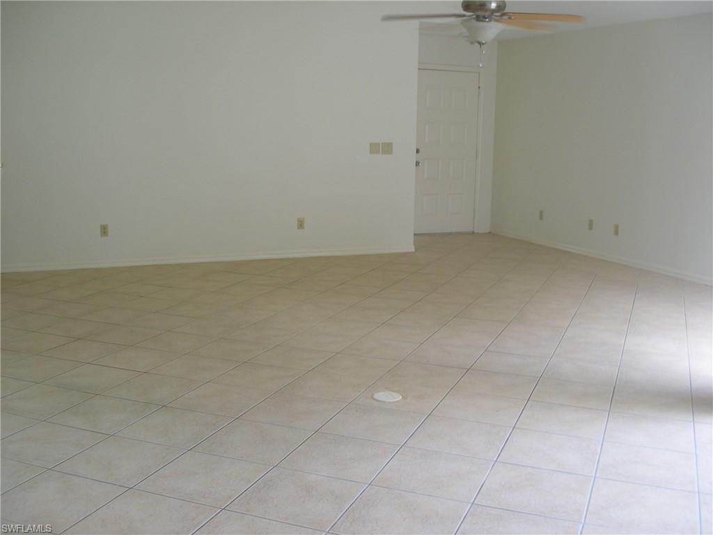 3342 Timberwood Circle Naples, FL 34105 - Photo 3 of 17 wooden floor in a bathroom