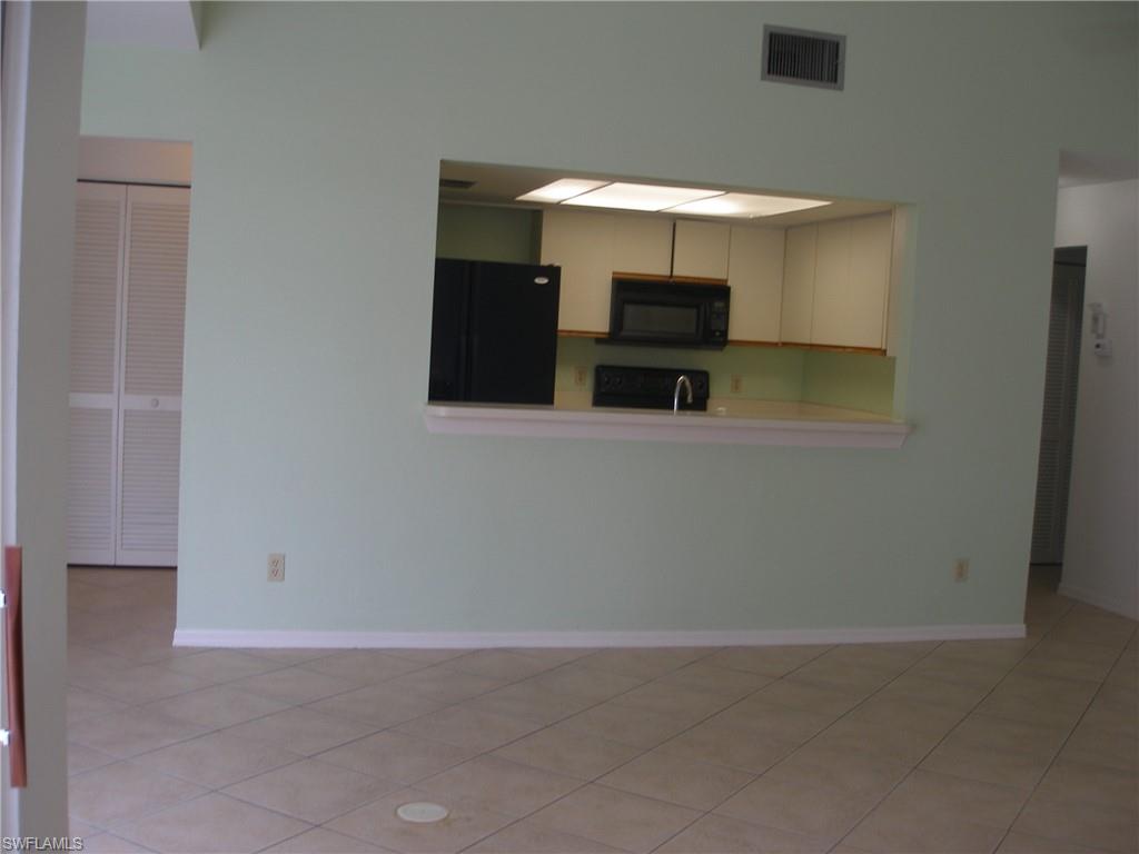 3342 Timberwood Circle Naples, FL 34105 - Photo 6 of 17 a view of kitchen with furniture