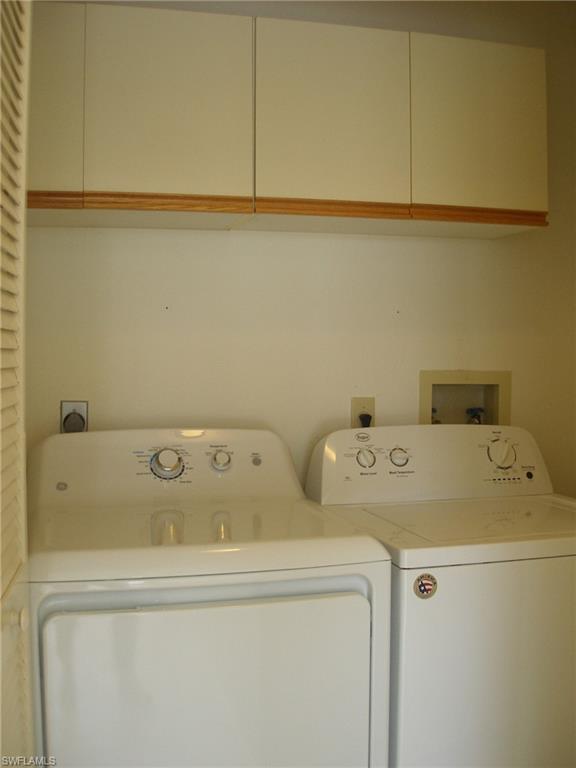 3342 Timberwood Circle Naples, FL 34105 - Photo 7 of 17 a utility room with dryer and washer