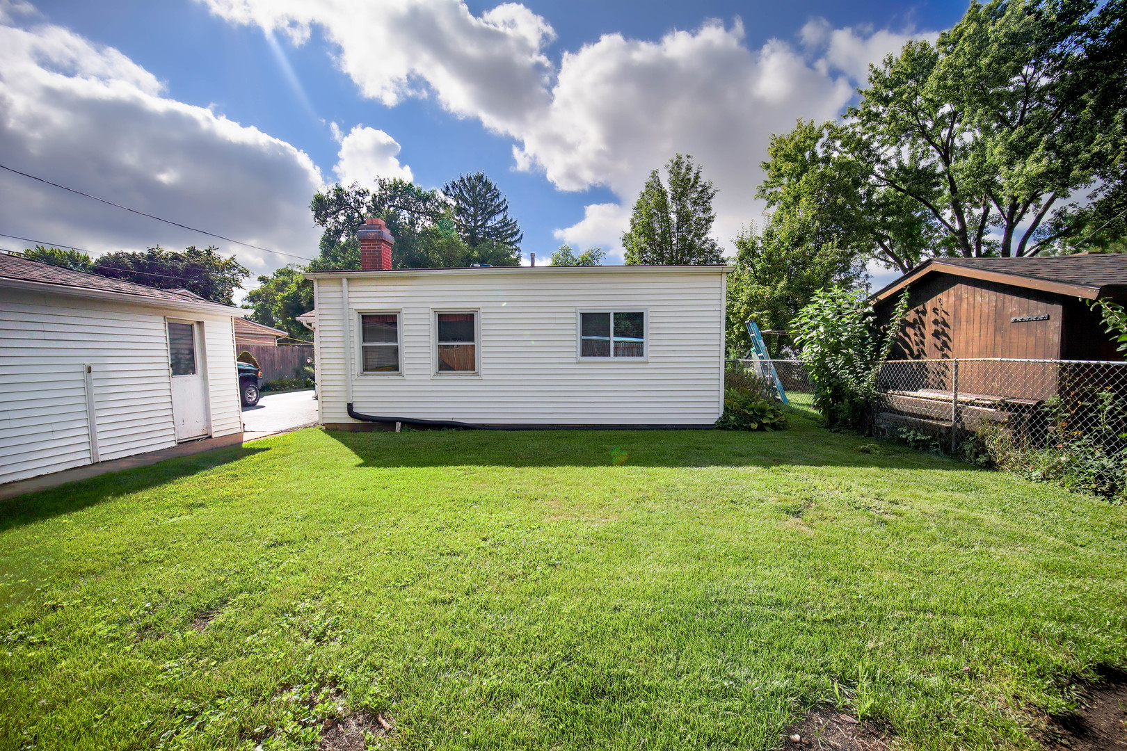 295 East Dennis Road Wheeling, IL 60090 - Photo 20 of 24 a view of a backyard with plants and a garden