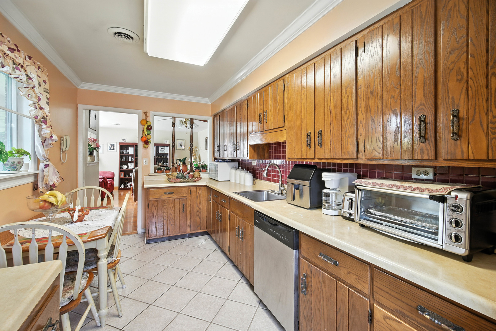 295 East Dennis Road Wheeling, IL 60090 - Photo 6 of 24 a kitchen with stainless steel appliances kitchen island granite countertop a sink and cabinets