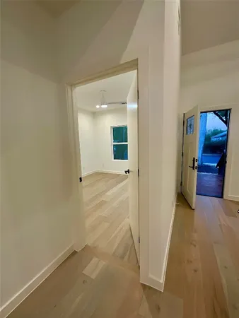 a large kitchen with stainless steel appliances a large counter top a stove and a sink