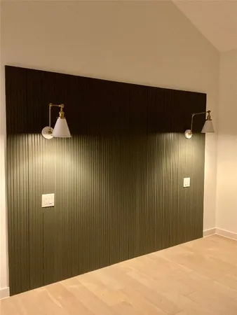 a bedroom with a bed and ceiling fan