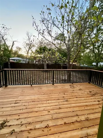 a spacious bathroom with a double vanity sink a toilet and a tub
