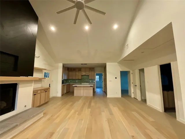 a large kitchen with cabinets and stainless steel appliances
