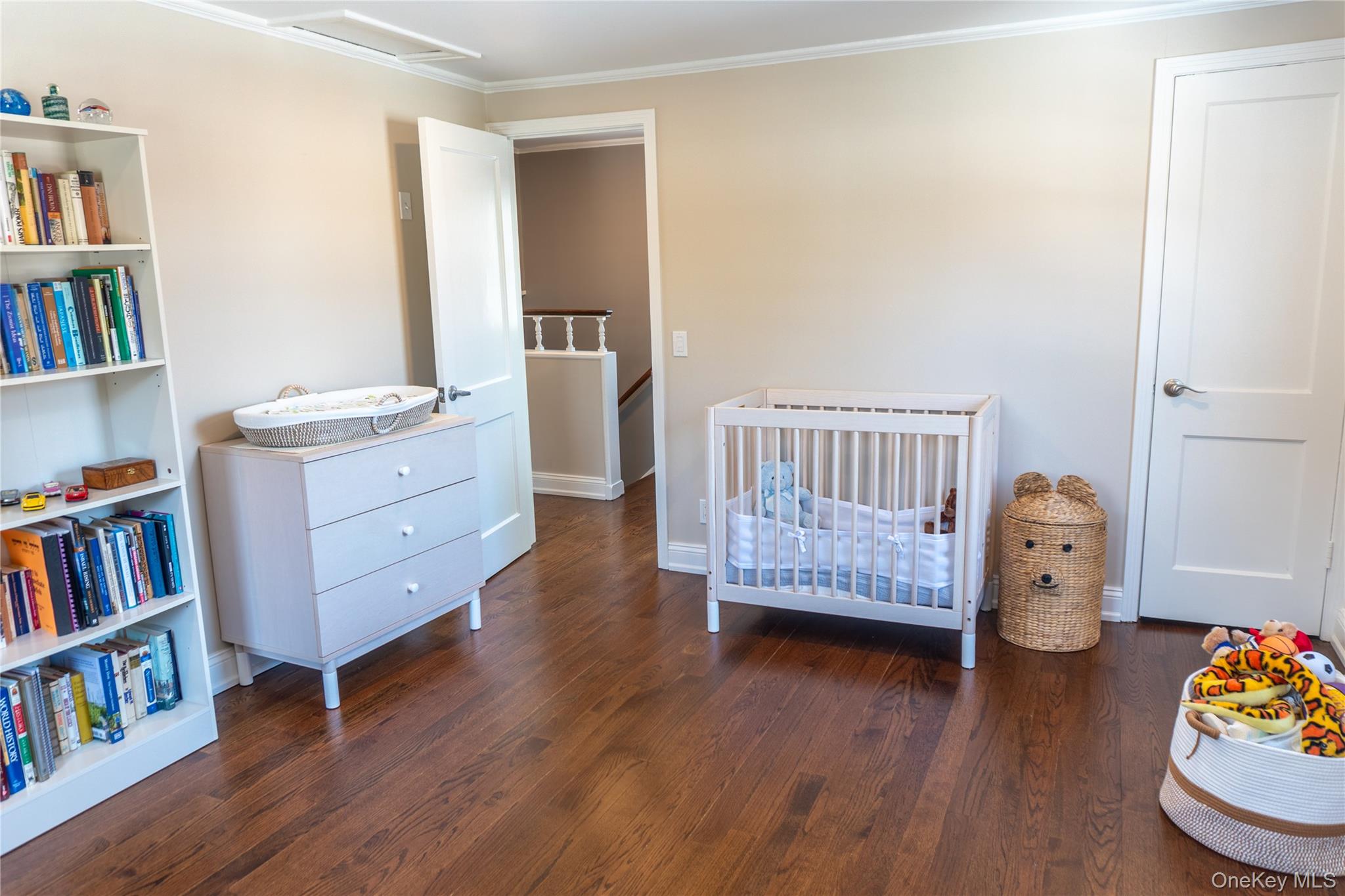 93 Beverly Road White Plains, NY 10605 - Photo 11 of 14 a bedroom with furniture and book shelf