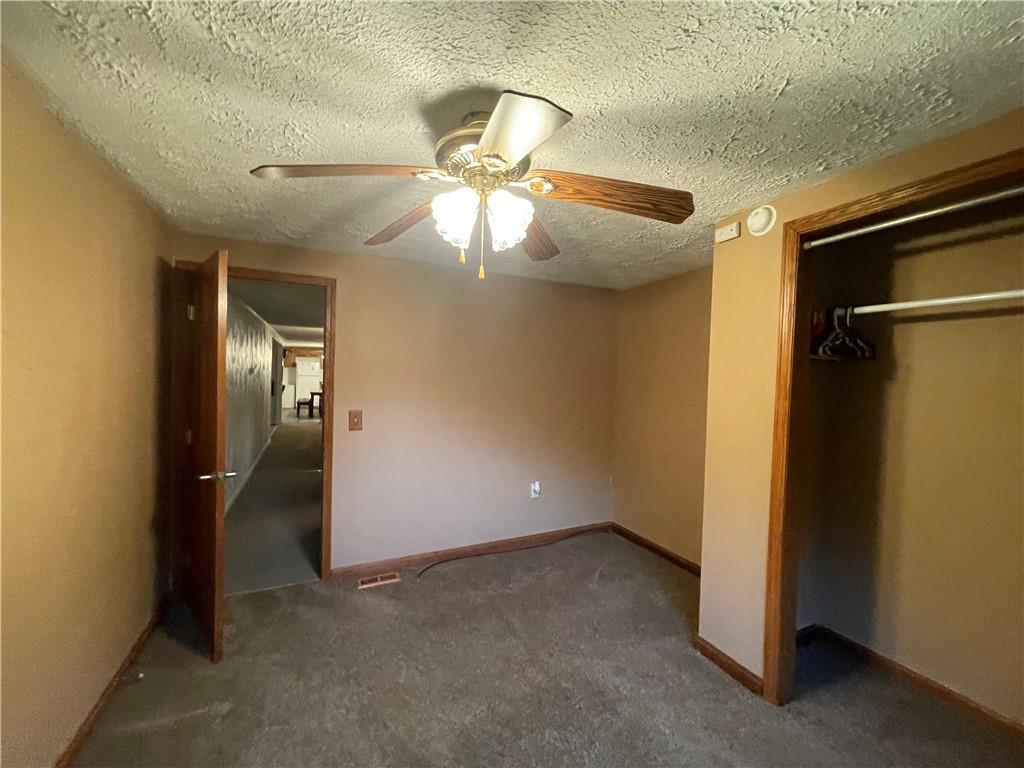 474 Iron Rock Road Waynesburg, PA 15370 - Photo 9 of 15 en empty room with closet and a ceiling fan