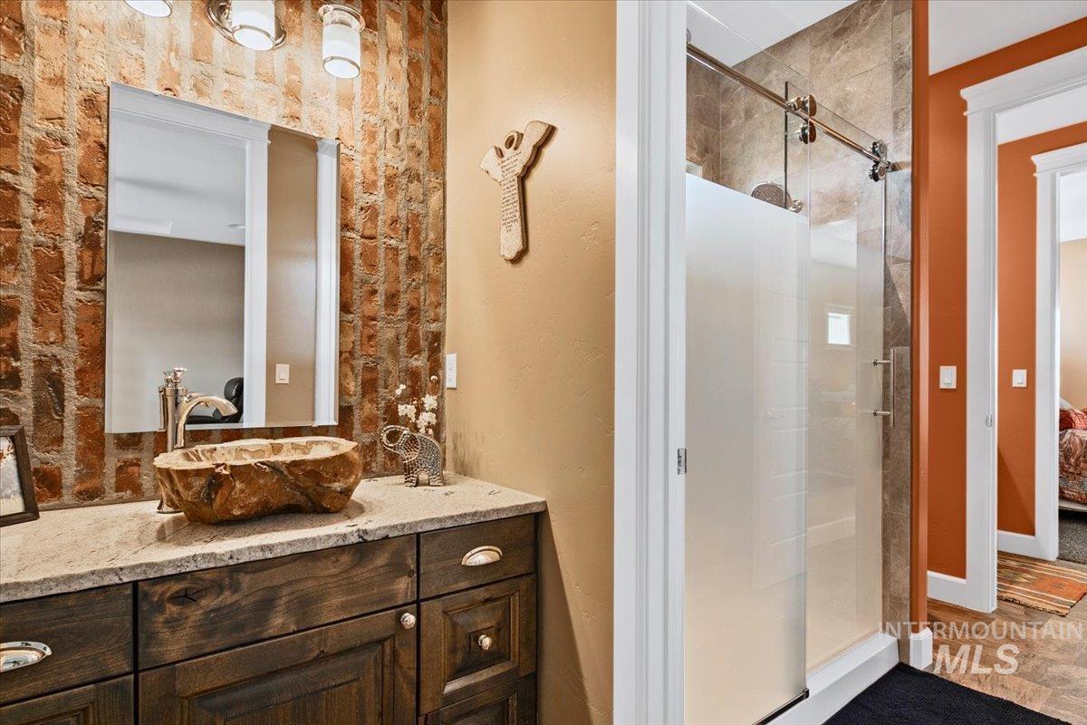 24053 Pheasant Ridge Court Middleton, ID 83644 - Photo 32 of 50 Full bath with a shower stall, connected bathroom, and vanity