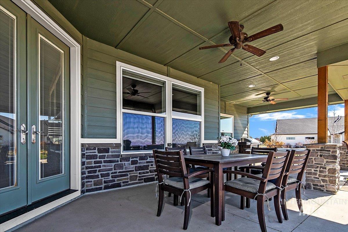 24053 Pheasant Ridge Court Middleton, ID 83644 - Photo 36 of 50 View of patio featuring ceiling fan and outdoor dining area