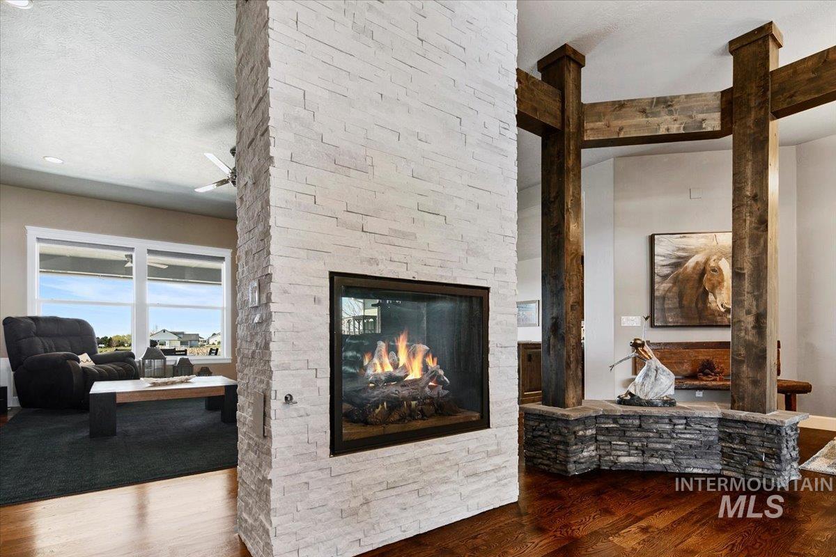 24053 Pheasant Ridge Court Middleton, ID 83644 - Photo 7 of 50 Detailed view of wood finished floors and a stone fireplace