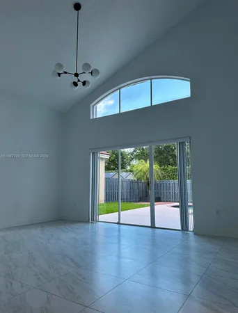 a view of an empty room with a balcony