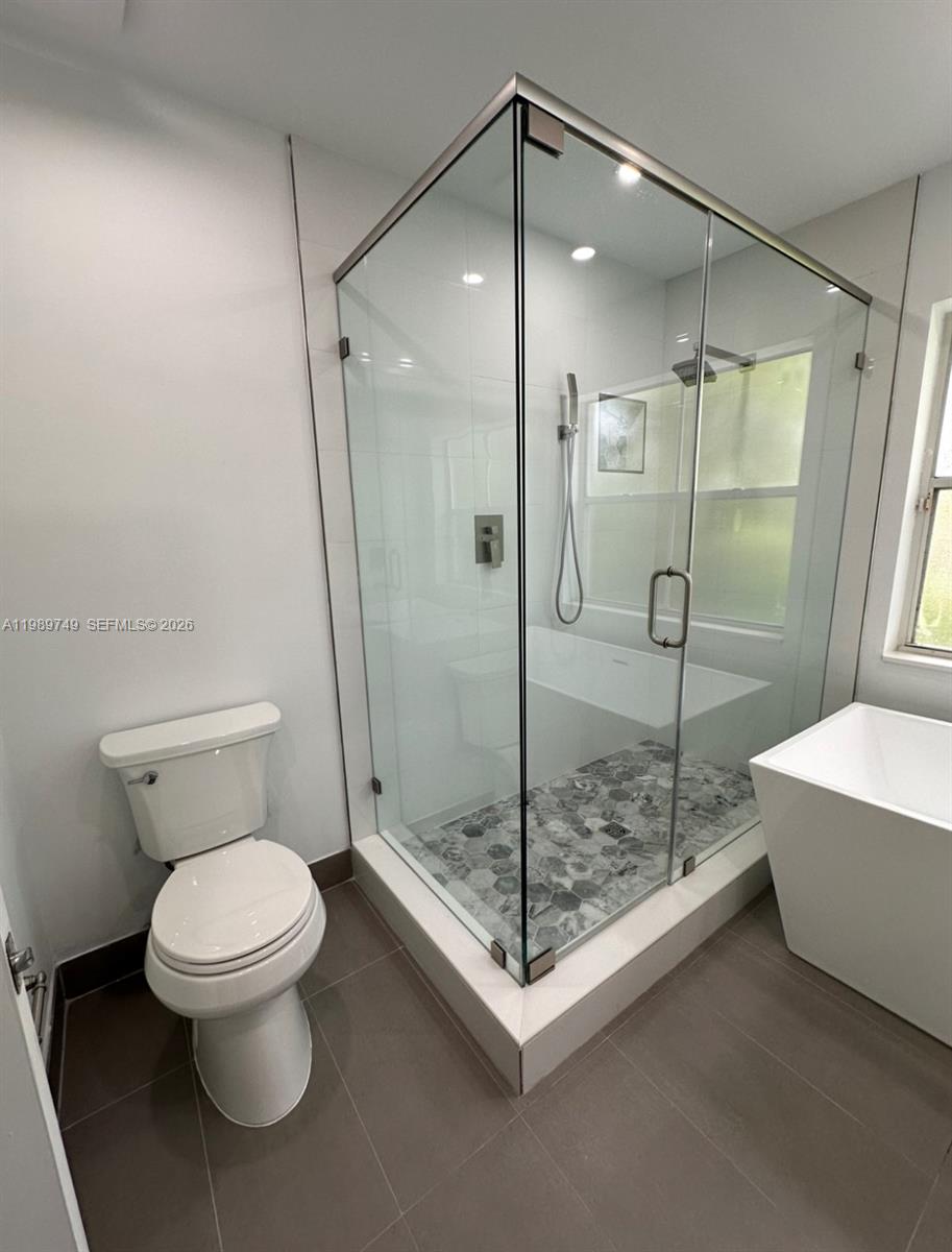 4021 Southwest 153rd Avenue Miramar, FL 33027 - Photo 14 of 42 a bathroom with a toilet and a shower