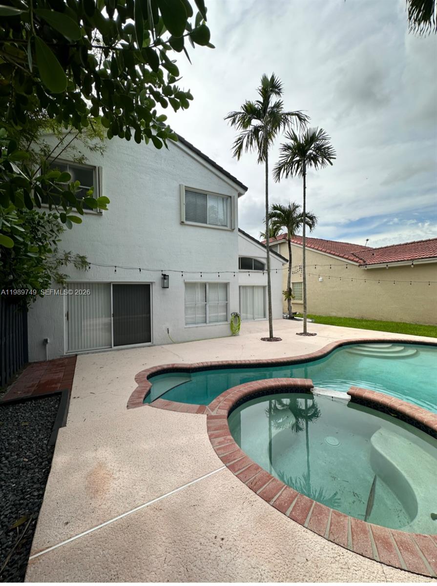 4021 Southwest 153rd Avenue Miramar, FL 33027 - Photo 17 of 42 a view of a house with pool