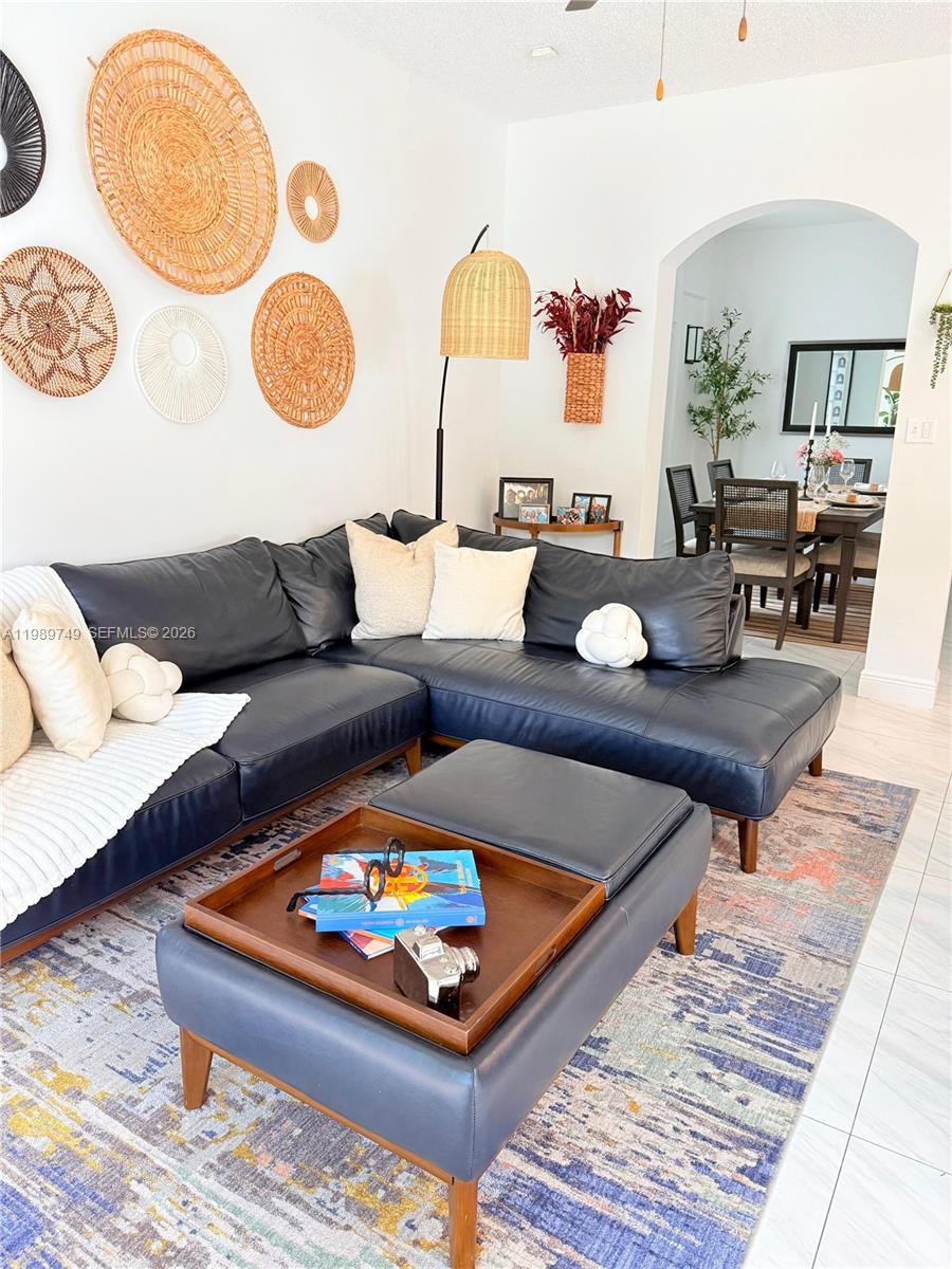 4021 Southwest 153rd Avenue Miramar, FL 33027 - Photo 28 of 42 a living room with furniture and a table