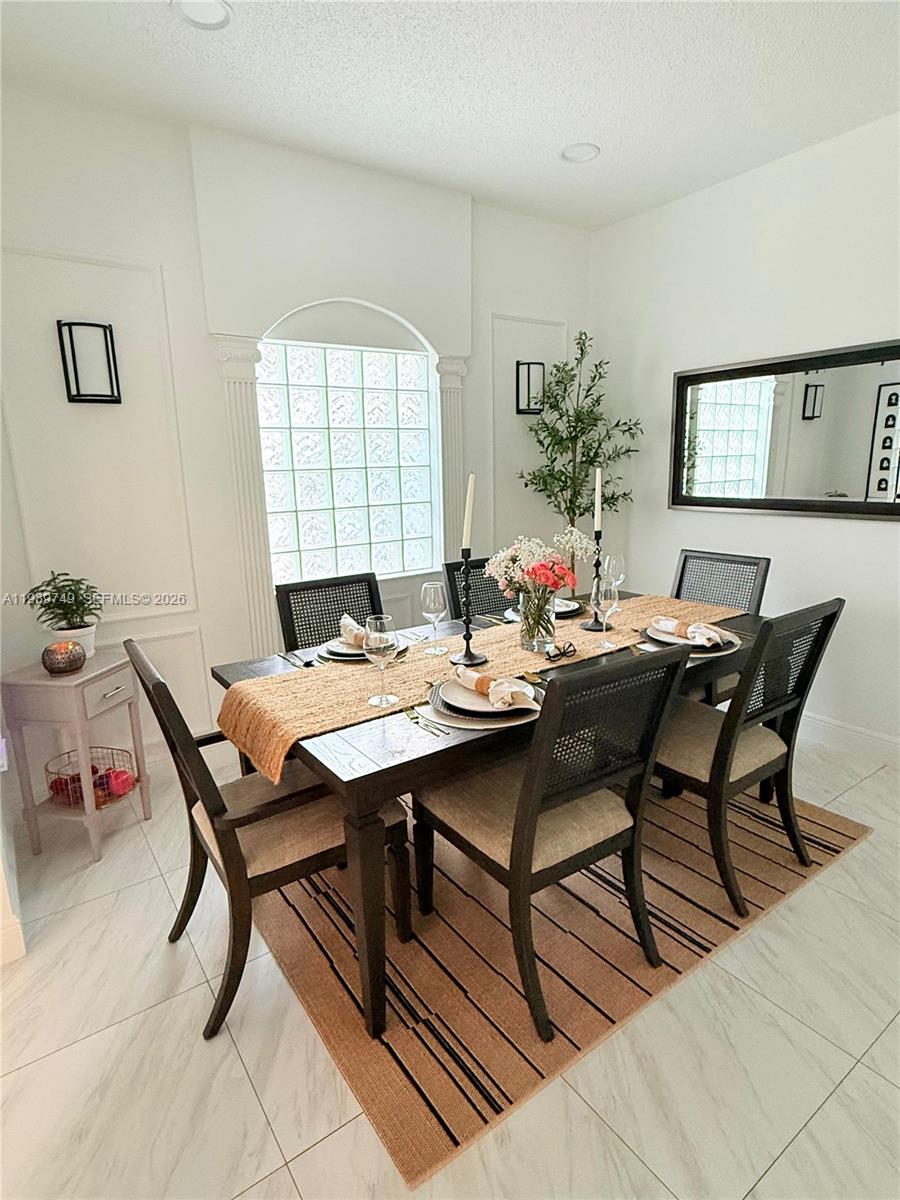 4021 Southwest 153rd Avenue Miramar, FL 33027 - Photo 29 of 42 a view of a dining room with furniture and window
