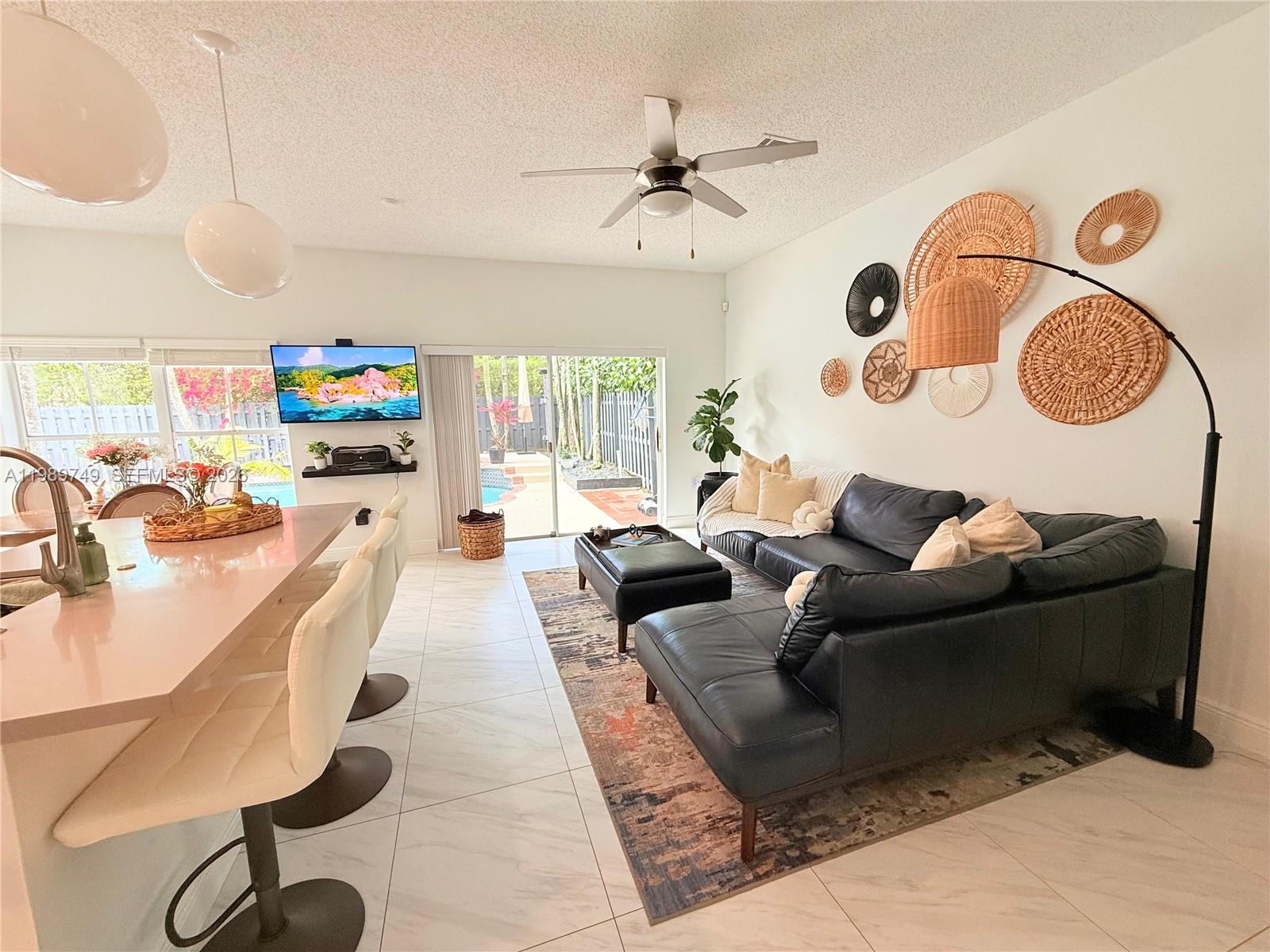 4021 Southwest 153rd Avenue Miramar, FL 33027 - Photo 30 of 42 a living room with furniture and a window