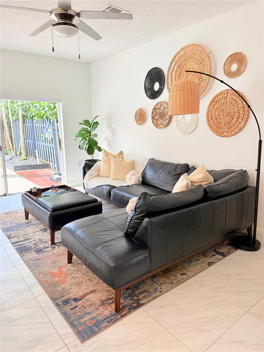 4021 Southwest 153rd Avenue Miramar, FL 33027 - Photo 34 of 42 a living room with furniture and a rug