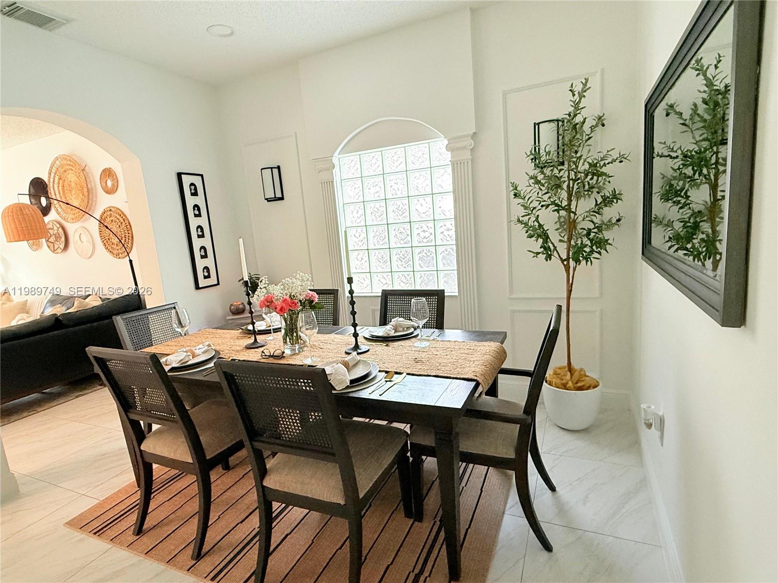 4021 Southwest 153rd Avenue Miramar, FL 33027 - Photo 37 of 42 a dining room with furniture and window
