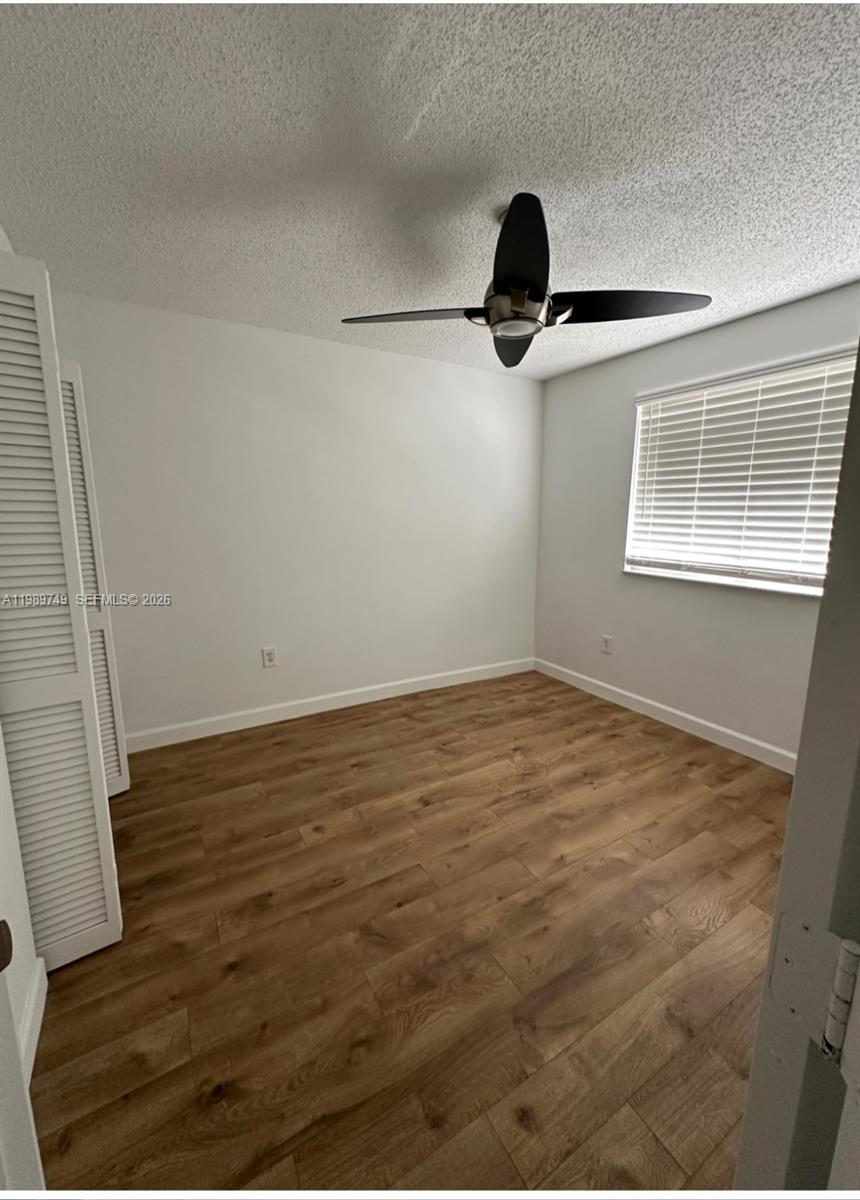 4021 Southwest 153rd Avenue Miramar, FL 33027 - Photo 7 of 42 a view of a room with wooden floor and windows