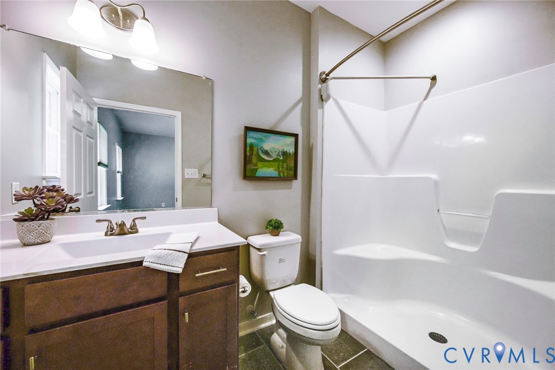 1297 Manfield Road Aylett, VA 23009 - Photo 14 of 41 a bathroom with a sink toilet and shower