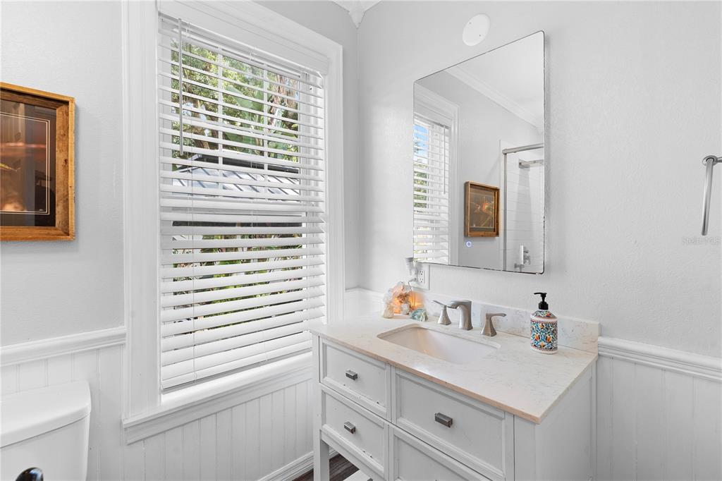 6501 Matchett Road Belle Isle, FL 32809 - Photo 14 of 43 a bathroom with a sink a vanity and a window