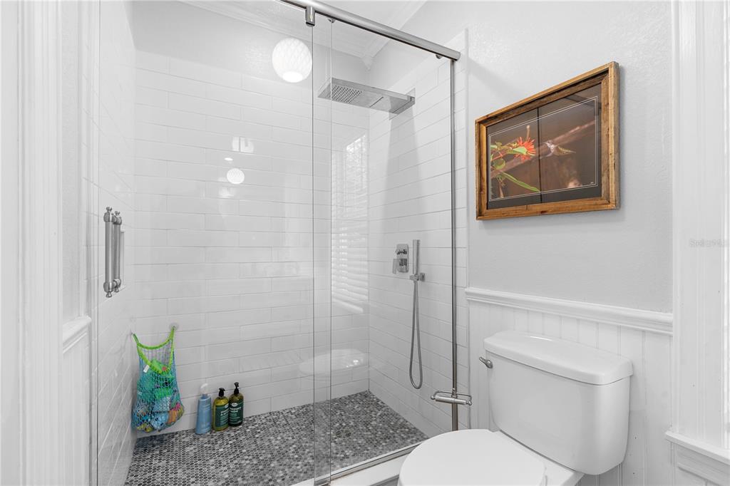 6501 Matchett Road Belle Isle, FL 32809 - Photo 15 of 43 a bathroom with a toilet a sink and shower