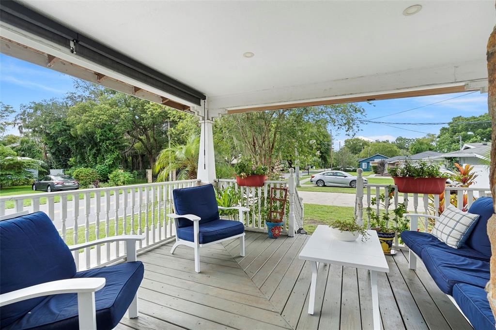 6501 Matchett Road Belle Isle, FL 32809 - Photo 3 of 43 a view of a balcony with chairs and wooden floor