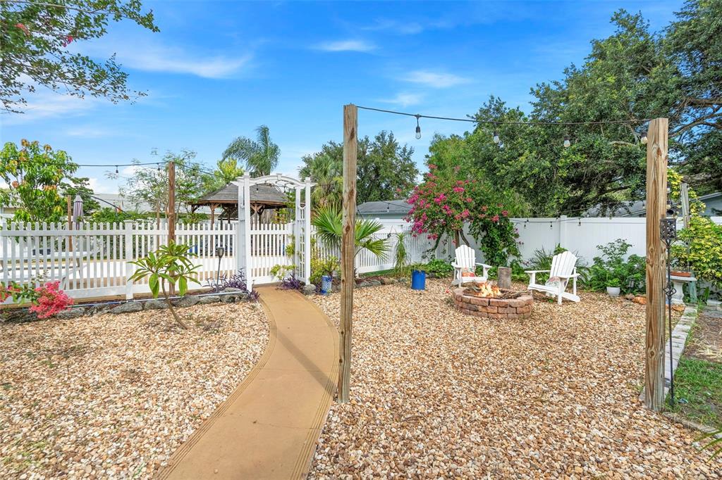 6501 Matchett Road Belle Isle, FL 32809 - Photo 32 of 43 a view of a yard with plants and a bench in the patio