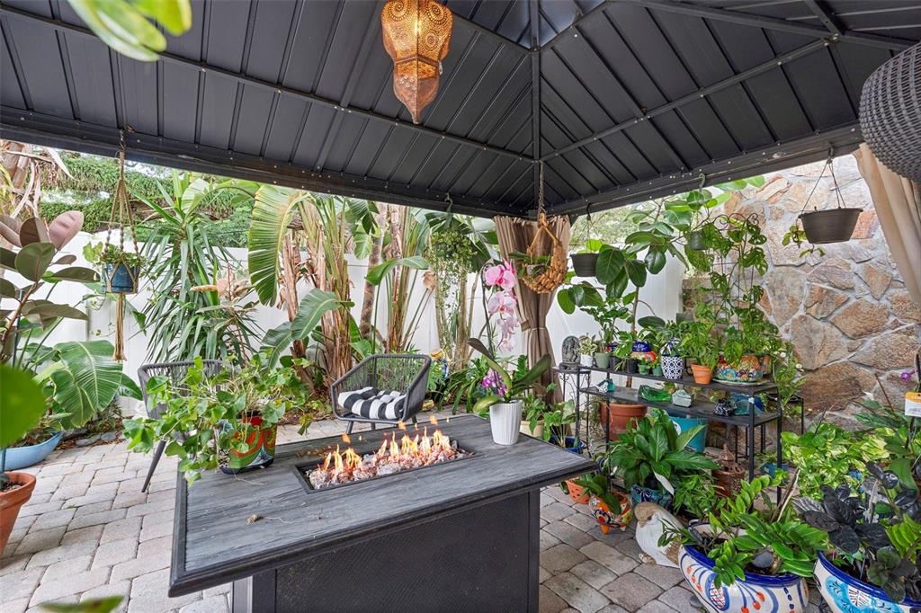 6501 Matchett Road Belle Isle, FL 32809 - Photo 35 of 43 a outdoor view of a patio with table and chairs potted plants