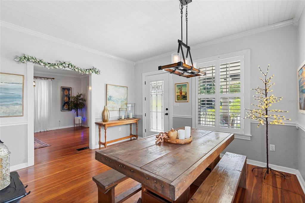 6501 Matchett Road Belle Isle, FL 32809 - Photo 7 of 43 a view of a dining room with furniture window and wooden floor