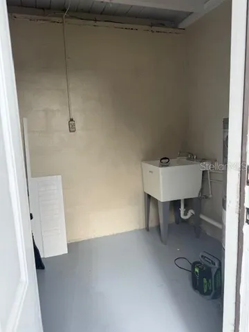 a bathroom with a toilet a sink and bathtub