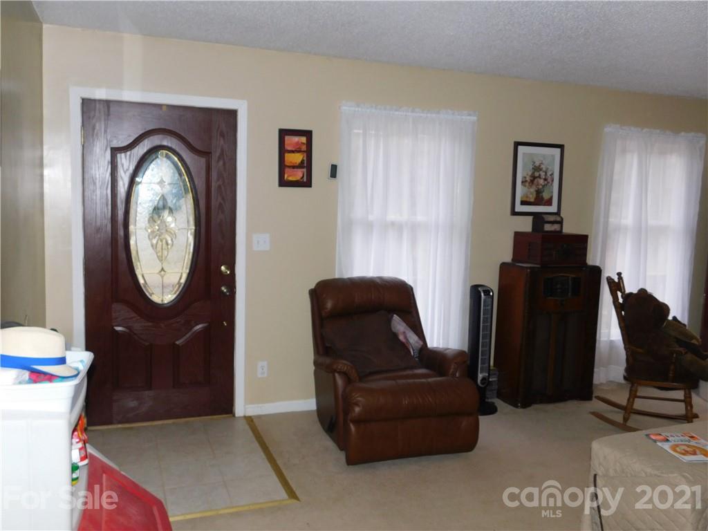 1835 Sharon Road York, SC 29745 - Photo 12 of 21 a living room with furniture and a mirror