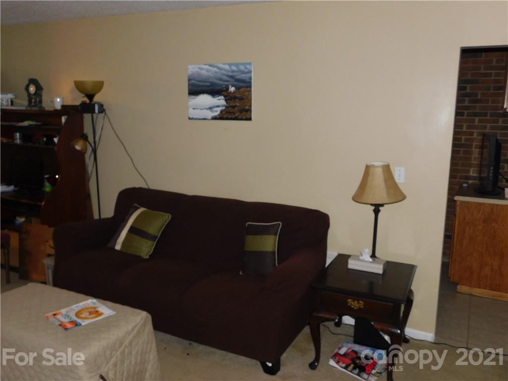 1835 Sharon Road York, SC 29745 - Photo 14 of 21 a bedroom with a bed and a lamp on table