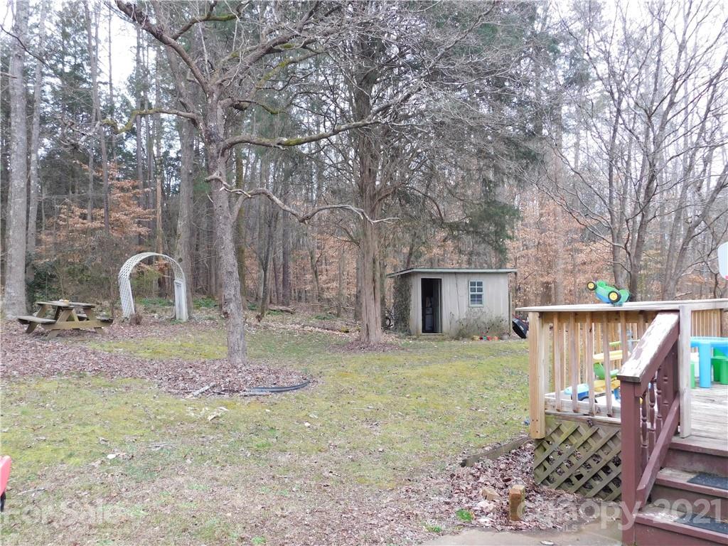 1835 Sharon Road York, SC 29745 - Photo 20 of 21 a backyard of a house with table and chairs