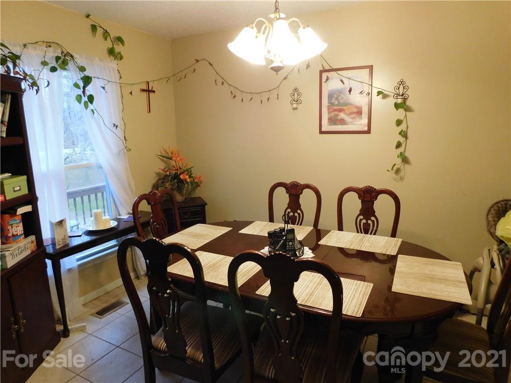 1835 Sharon Road York, SC 29745 - Photo 8 of 21 a view of a dining room with furniture and chandelier