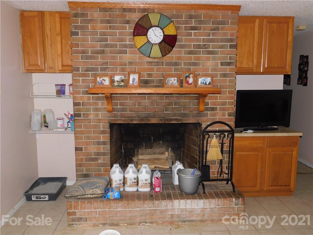 1835 Sharon Road York, SC 29745 - Photo 10 of 21 a living room with fireplace furniture and a wooden floor