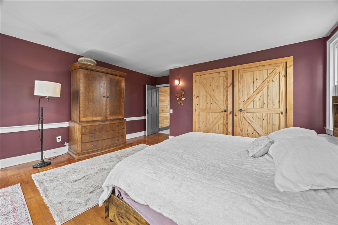 2385 Dow Road York, NY 14533 - Photo 24 of 43 Primary Bedroom showcasing the Custom Barn Closet