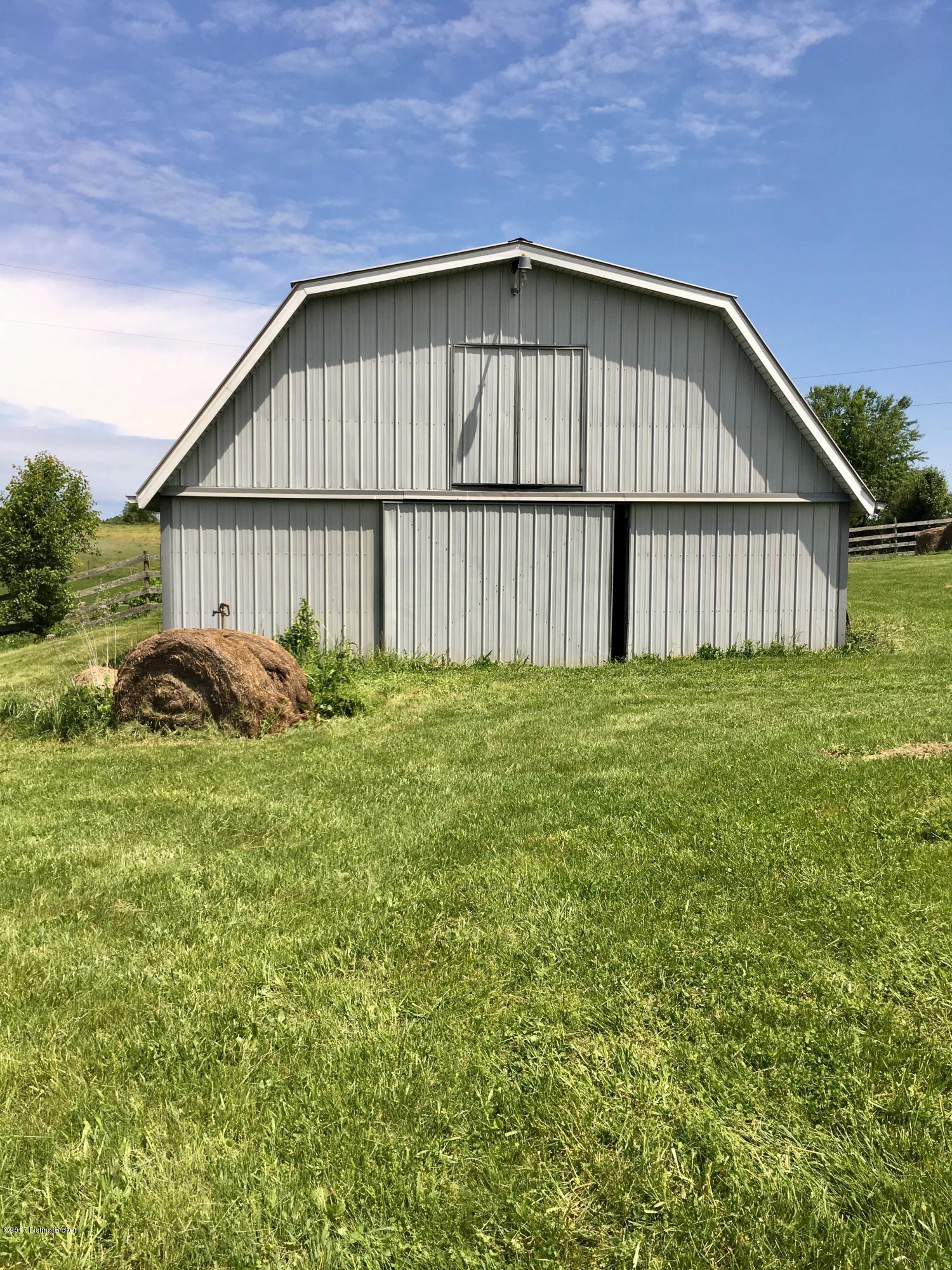 3388 Holy Cross Road Loretto, KY 40037 - Photo 8 of 21 Barn has sliding doors on top and bottom and there is a water spicket located behind that hay bale.
