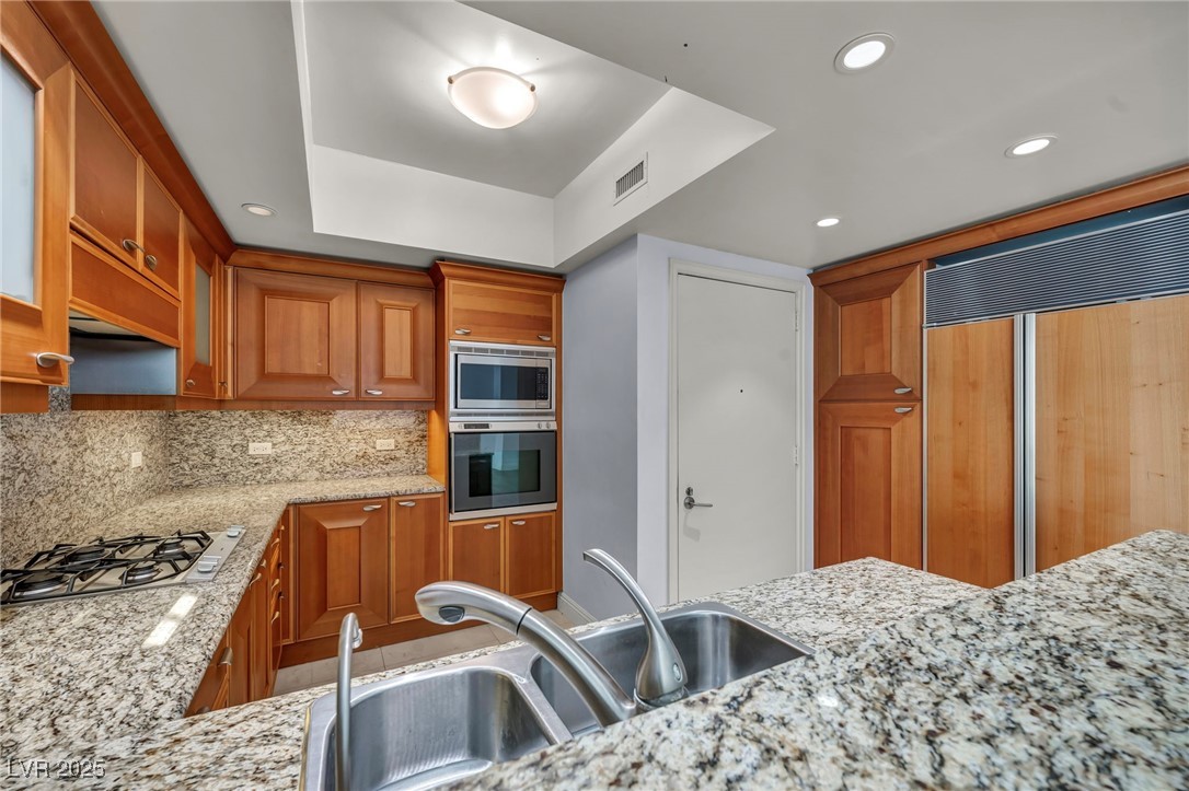 2777 Paradise Road, Unit 301 Las Vegas, NV 89109 - Photo 17 of 36 Cabinet-front, Builtin Refrigerator, Microwave & Oven