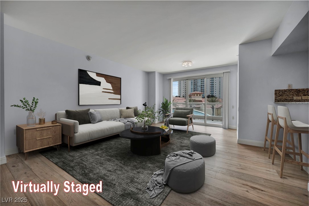 2777 Paradise Road, Unit 301 Las Vegas, NV 89109 - Photo 2 of 36 Living Room, virtually staged with balcony access