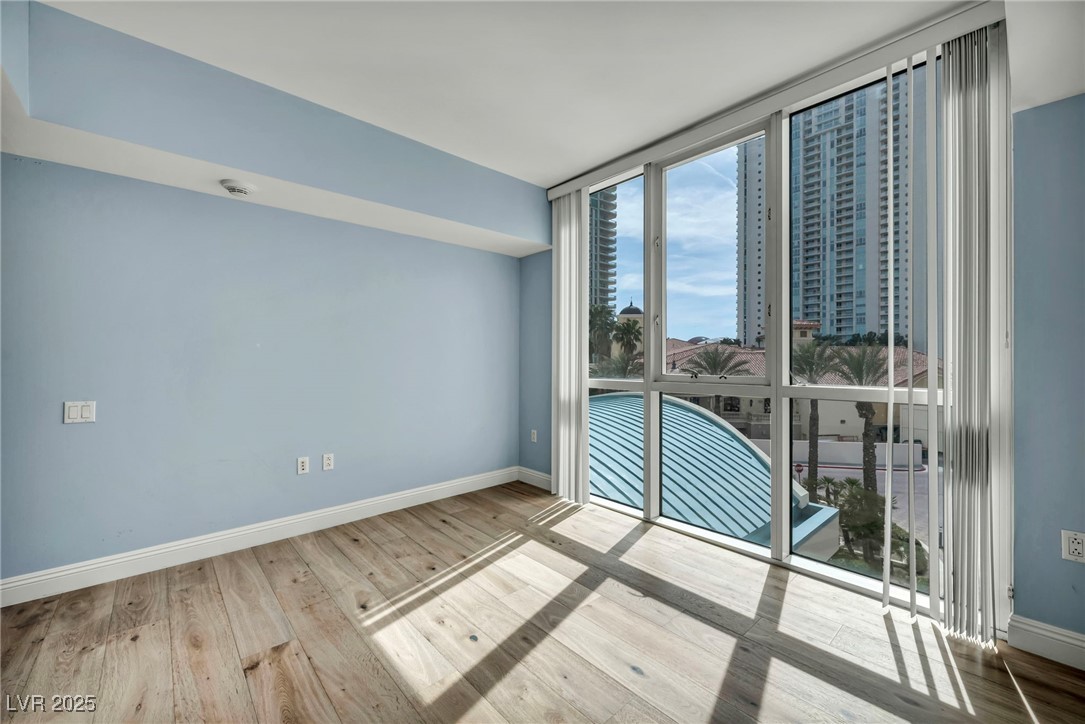 2777 Paradise Road, Unit 301 Las Vegas, NV 89109 - Photo 22 of 36 Primary Bedroom with Access to Balcony