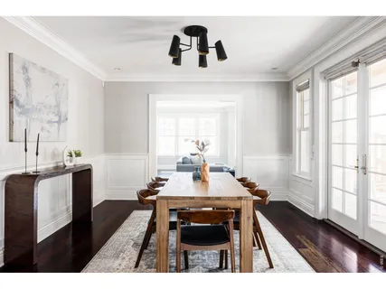 a dining room with table and chairs
