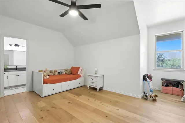 a room with a dresser and white walls